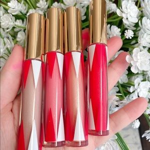 New. A set of 4 lipglosses Estée Lauder